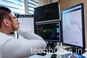 Indian college student stressed looking at falling stock market chart on laptop with options trading losses